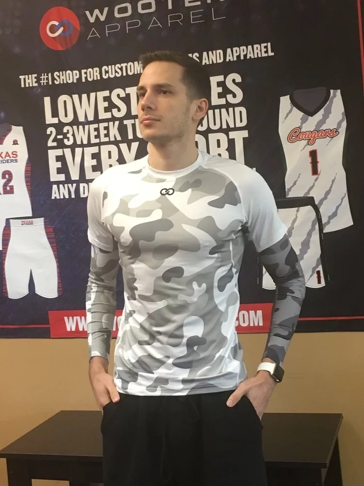 Person wear full custom compression jersey with camouflage pattern.