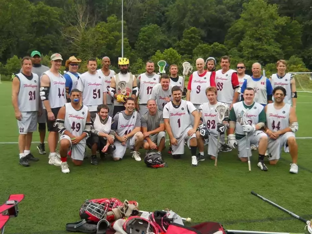Lacrosse team wearing custom lacrosse uniform, custom lacrosse jerseys and custom lacrosse shorts.