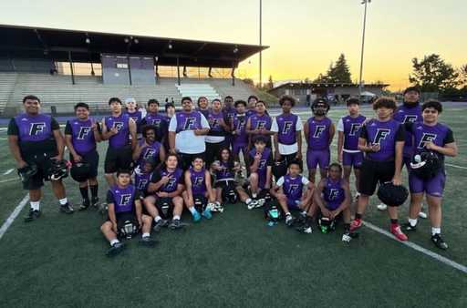 Football team wearing custom compression jersey and compression shorts, custom 7v7 uniforms.