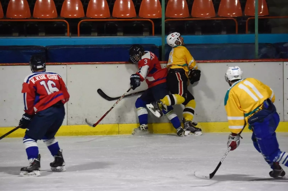 Hockey team wearing matching custom jerseys on the ice