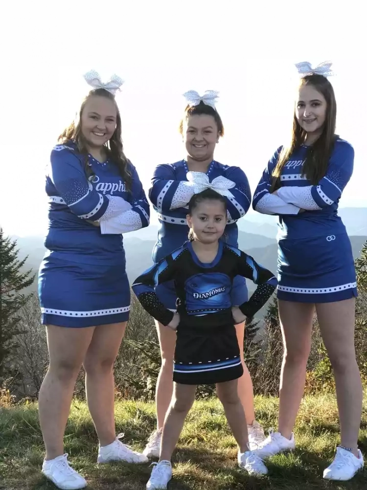 Cheerleaders wearing custom cheer uniforms from Wooter Apparel.