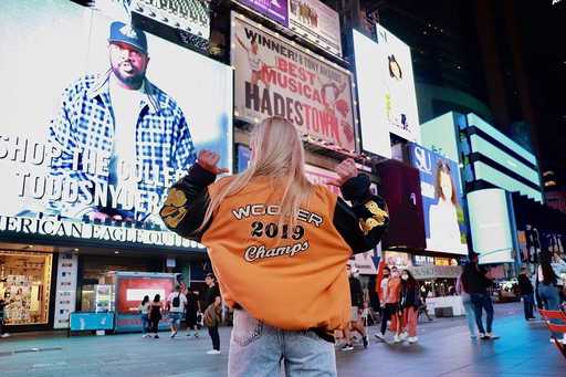 Custom bomber jacket in orange and black back view