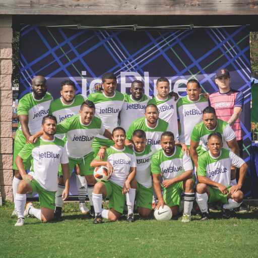 Team wearing green and white Custom Raglan Sleeve Crew Neck Soccer Jerseys