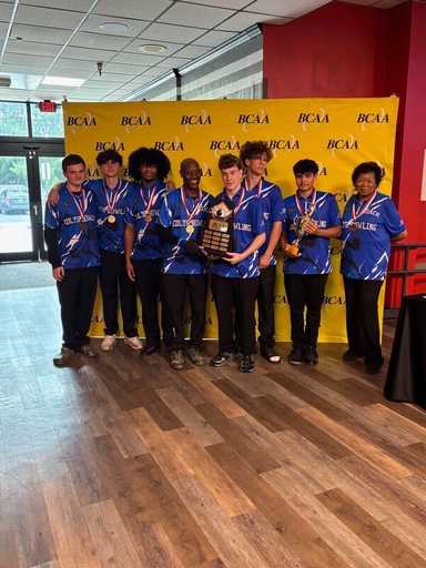 Bowling team wearing blue sublimated polo shirts at event
