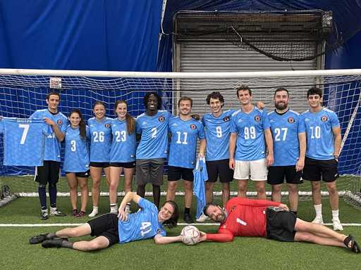 Soccer players wearing light blue custom v-neck soccer jerseys