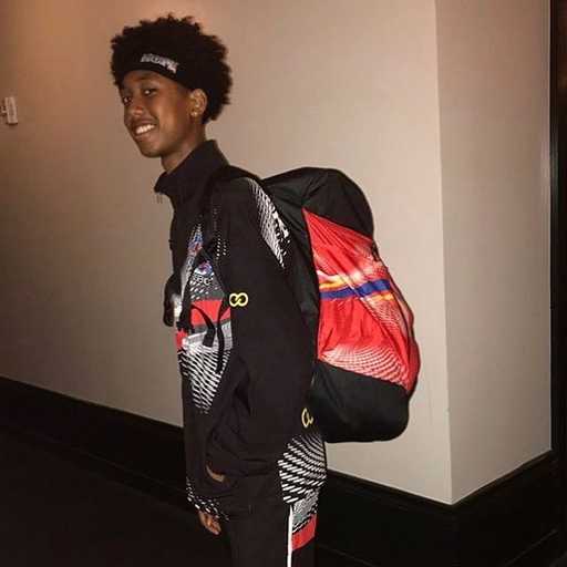 Player wearing black and red custom basketball backpack