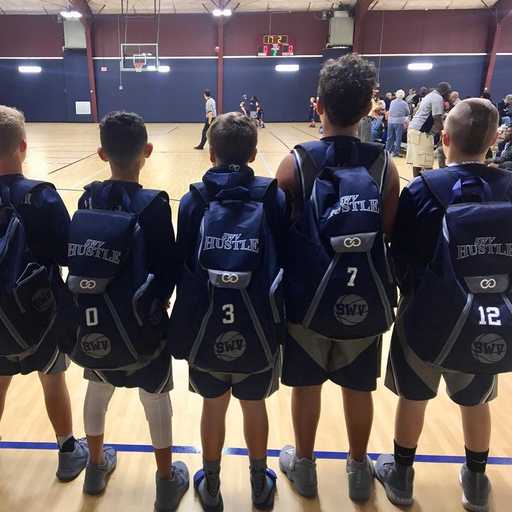 Team wearing matching custom basketball bags from back view