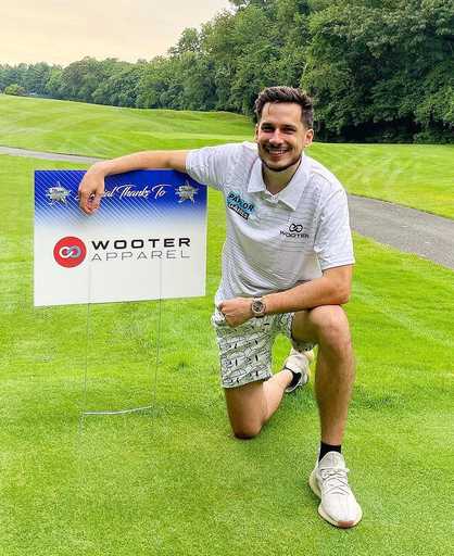 Athlete wearing sublimated polo shirt on golf course