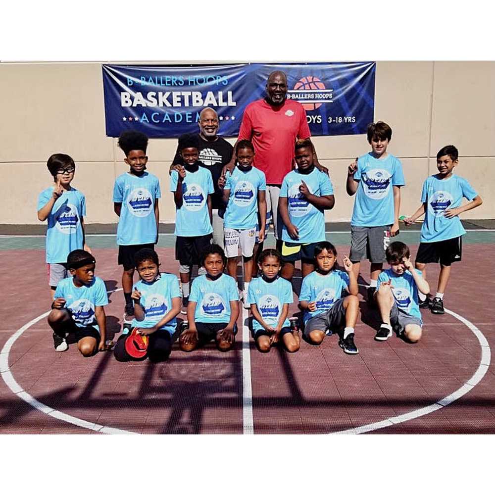 Youth team wearing blue custom basketball shooting shirts