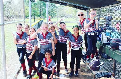 Youth baseball team wearing custom 2 button baseball jerseys after game