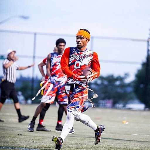 Player wearing colorful custom flag football shorts and jersey