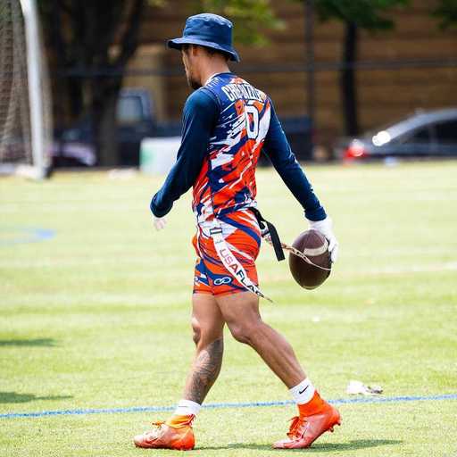 Player wearing custom flag football shorts with long sleeve uniform top