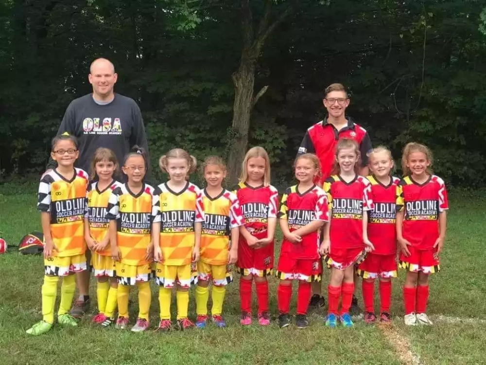 Youth soccer team wearing custom reversible v-neck soccer jerseys