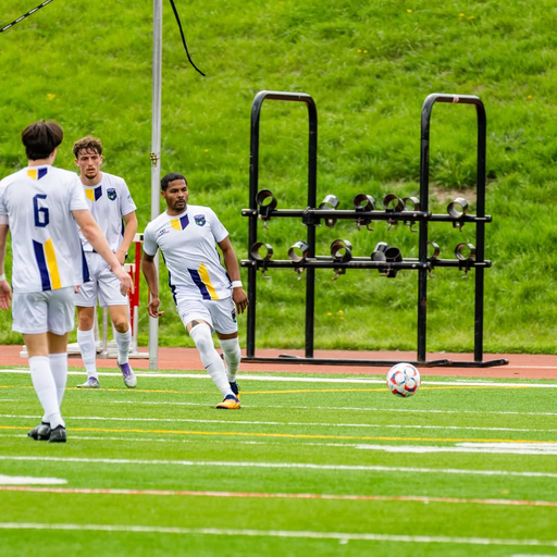 Soccer players wearing white custom reversible crew neck jerseys on field
