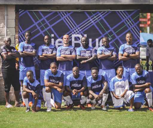 Team wearing blue custom reversible crew neck soccer jerseys after match