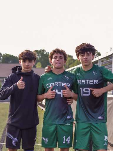 Soccer players wearing custom reversible v-neck soccer jerseys