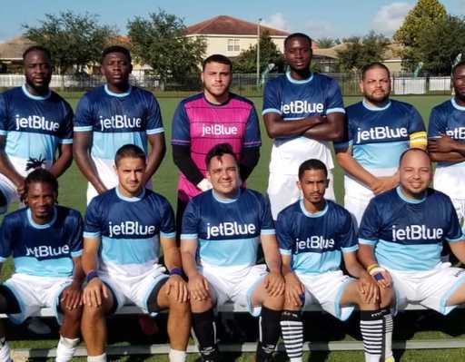 Soccer team wearing custom reversible raglan sleeve crew neck jerseys