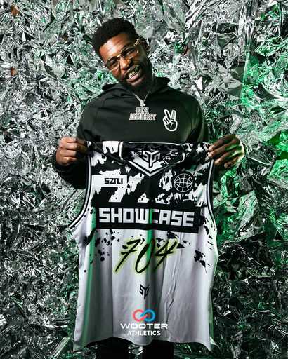 Full body view of custom black and green athletic jersey uniform
