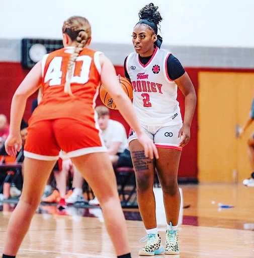 Women basketball players wearing custom design athletic shorts on court