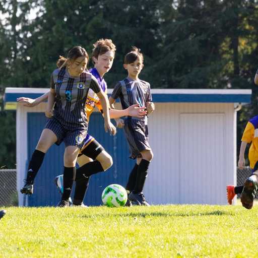 Soccer player wearing custom soccer shorts during an outdoor game