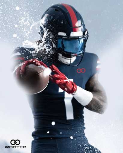 Football player catching ball with custom football gloves