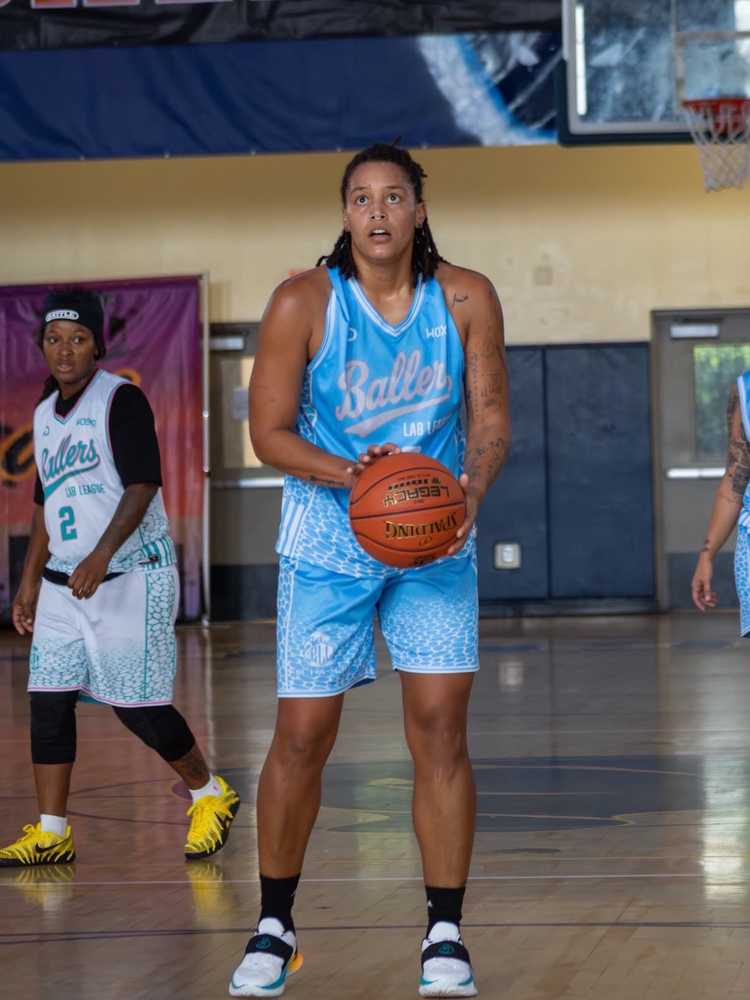 Player wearing blue custom basketball uniform with matching shorts