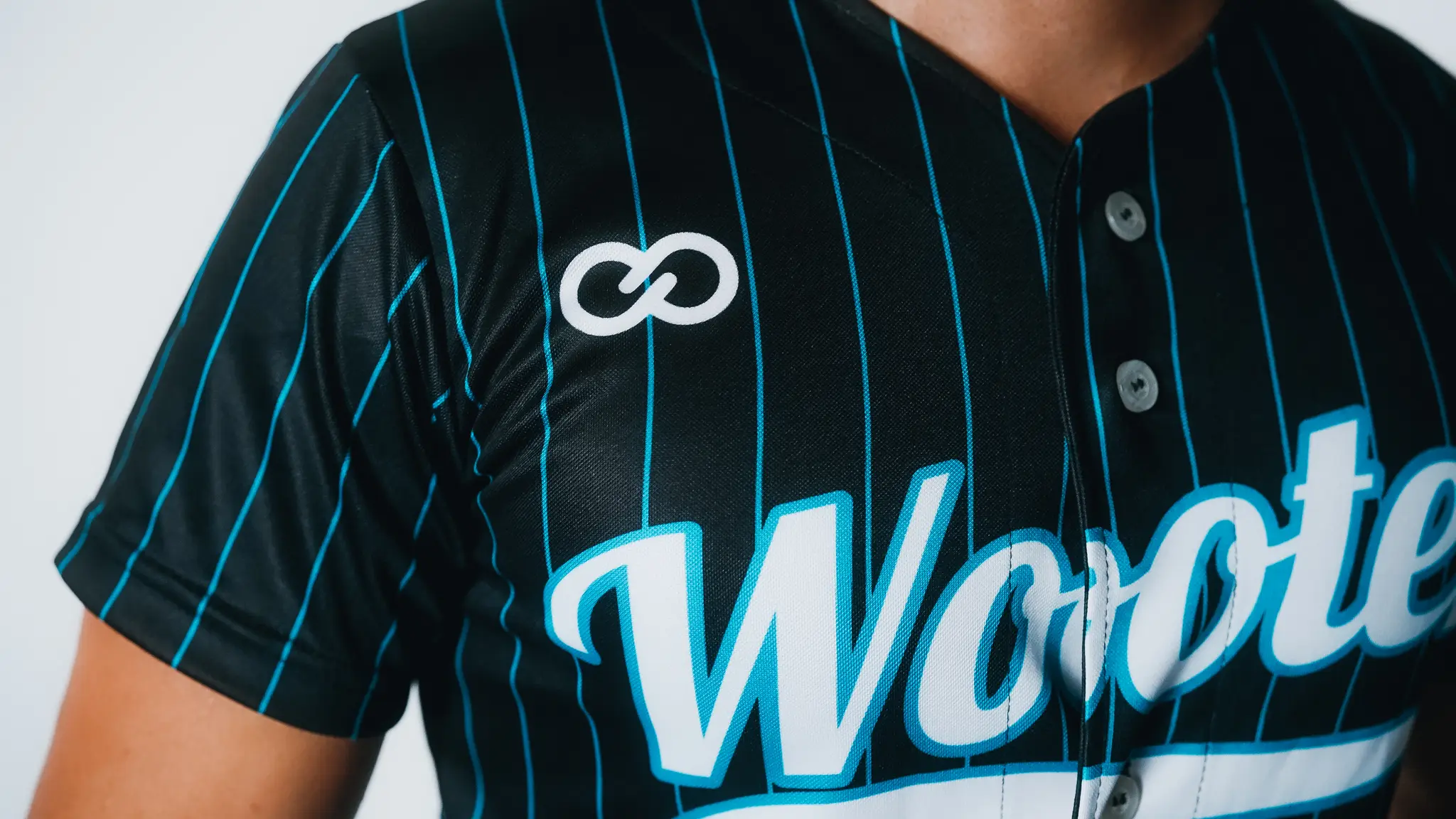 Baseball uniforms with detailed stitching for durability and a polished finish.