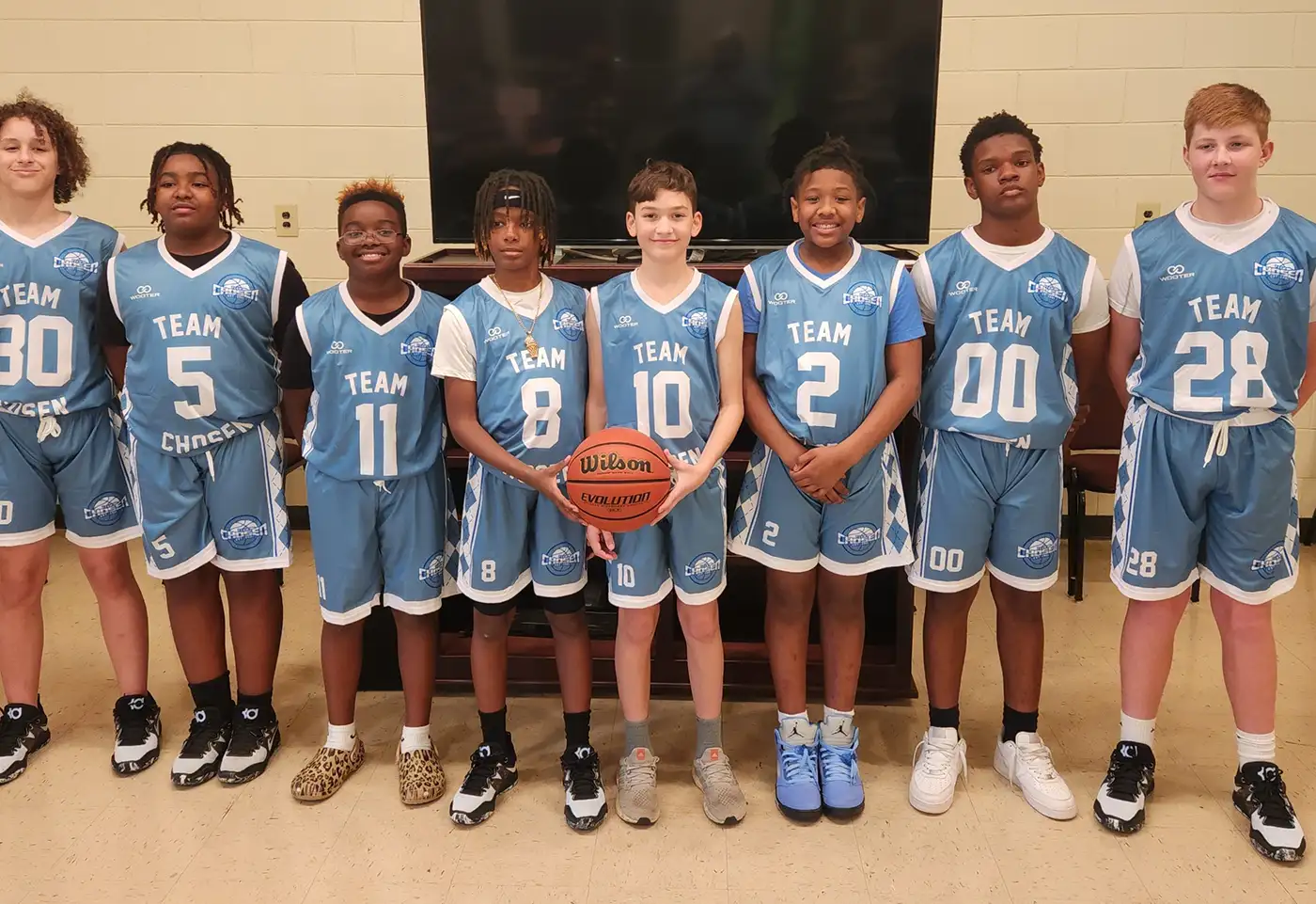 Team Chosen wearing Wooter Custom V-Neck Basketball Jerseys - sky blue design