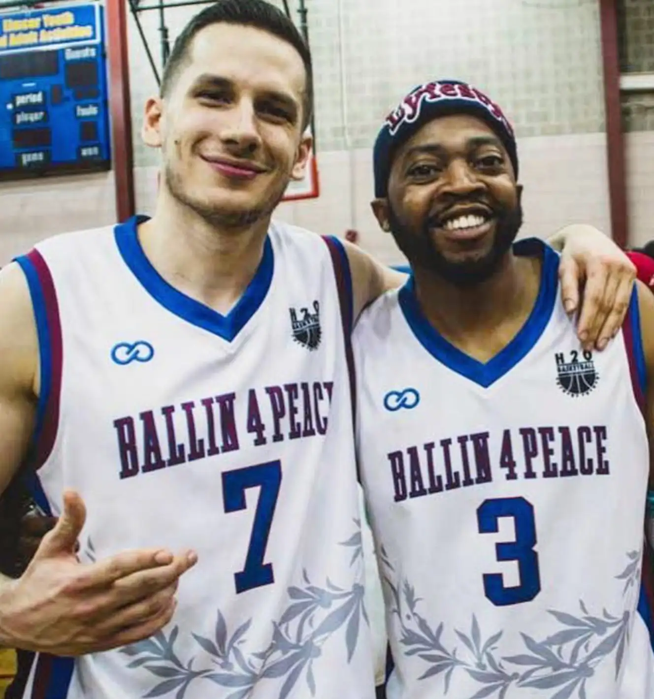 Players wearing Ballin 4 Peace- Blue and White Custom Basketball Jersey