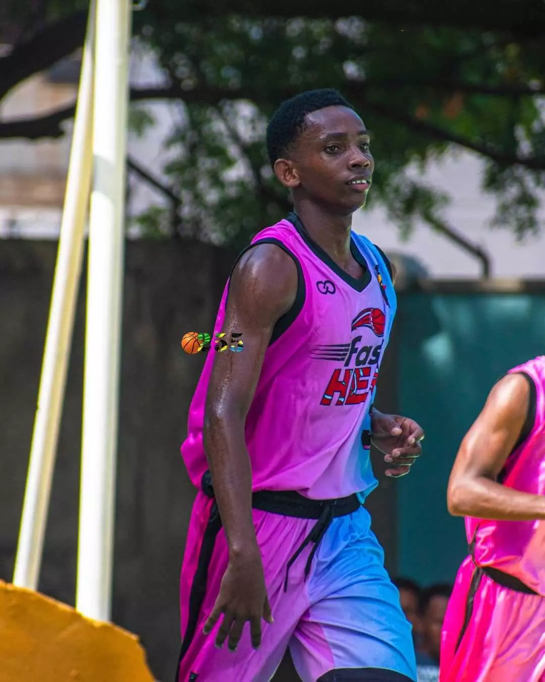 Players wearing Wooter Custom hot pink and columbia blue Basketball Shorts