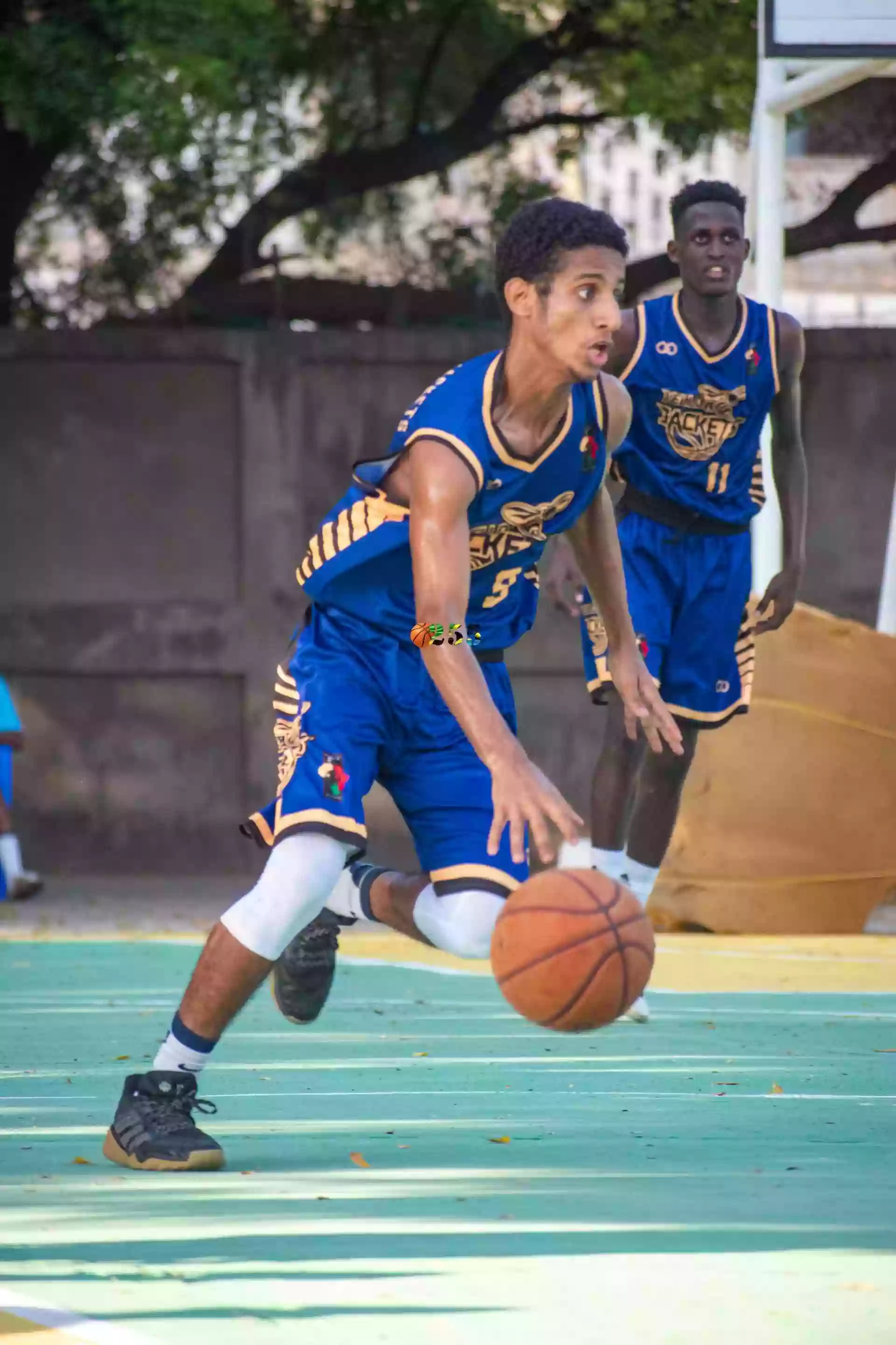 Players wearing Wooter Custom Black and royal Basketball Shorts
