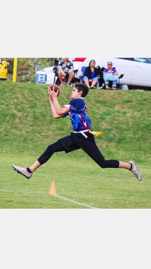 Live action flag football player wearing custom shorts