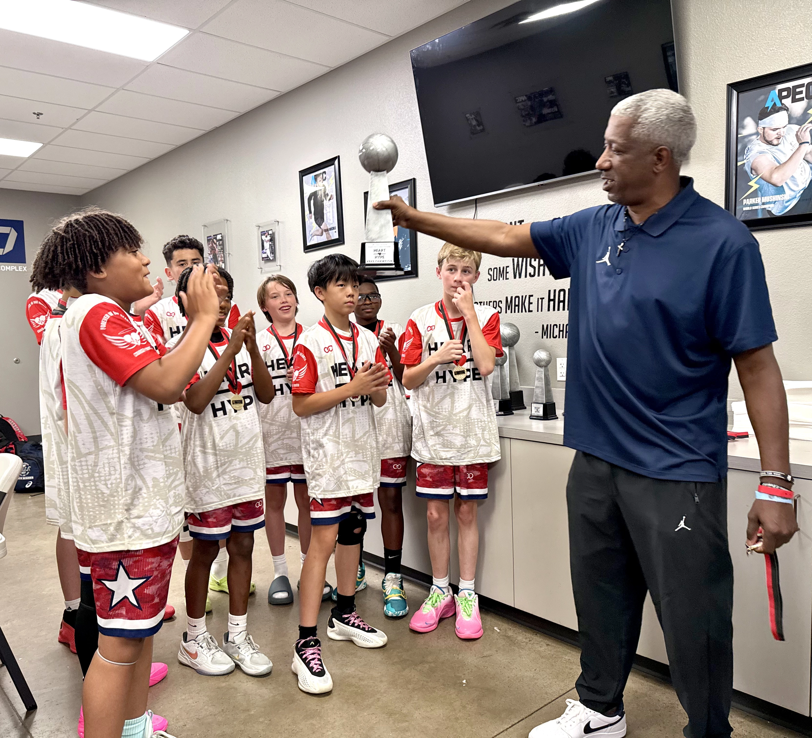 players wearing Heart Hype white and orange Custom Short Sleeve Crew Neck Basketball Jerseys