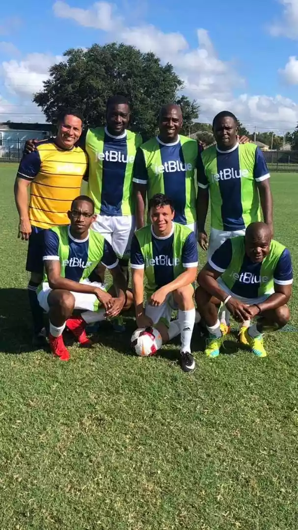 Soccer players wearing green and yellow custom crew neck soccer jerseys