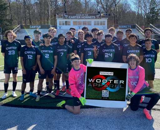 Soccer team with goalkeepers wearing pink custom crew neck goalie soccer jerseys with banner